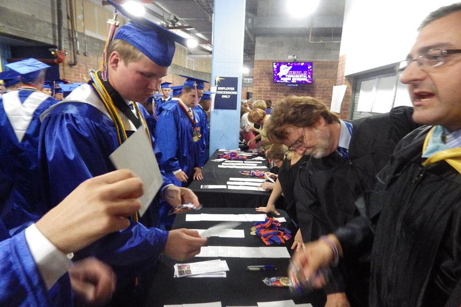 Mr. Mathews helps senior boys check in at 3:45 p.m.