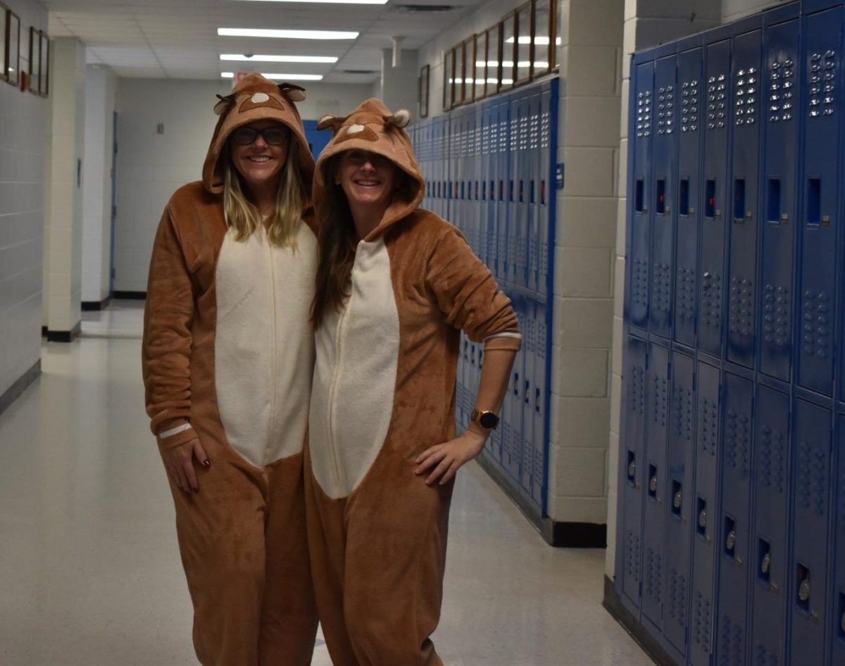 Mrs. Thompson and Mrs. Loope dressed in reindeer onesies for teacher spirit week.