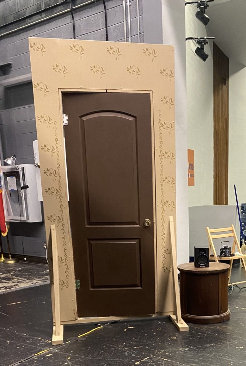 A door that sits on stage, where cast members will enter and exit through during the musical.