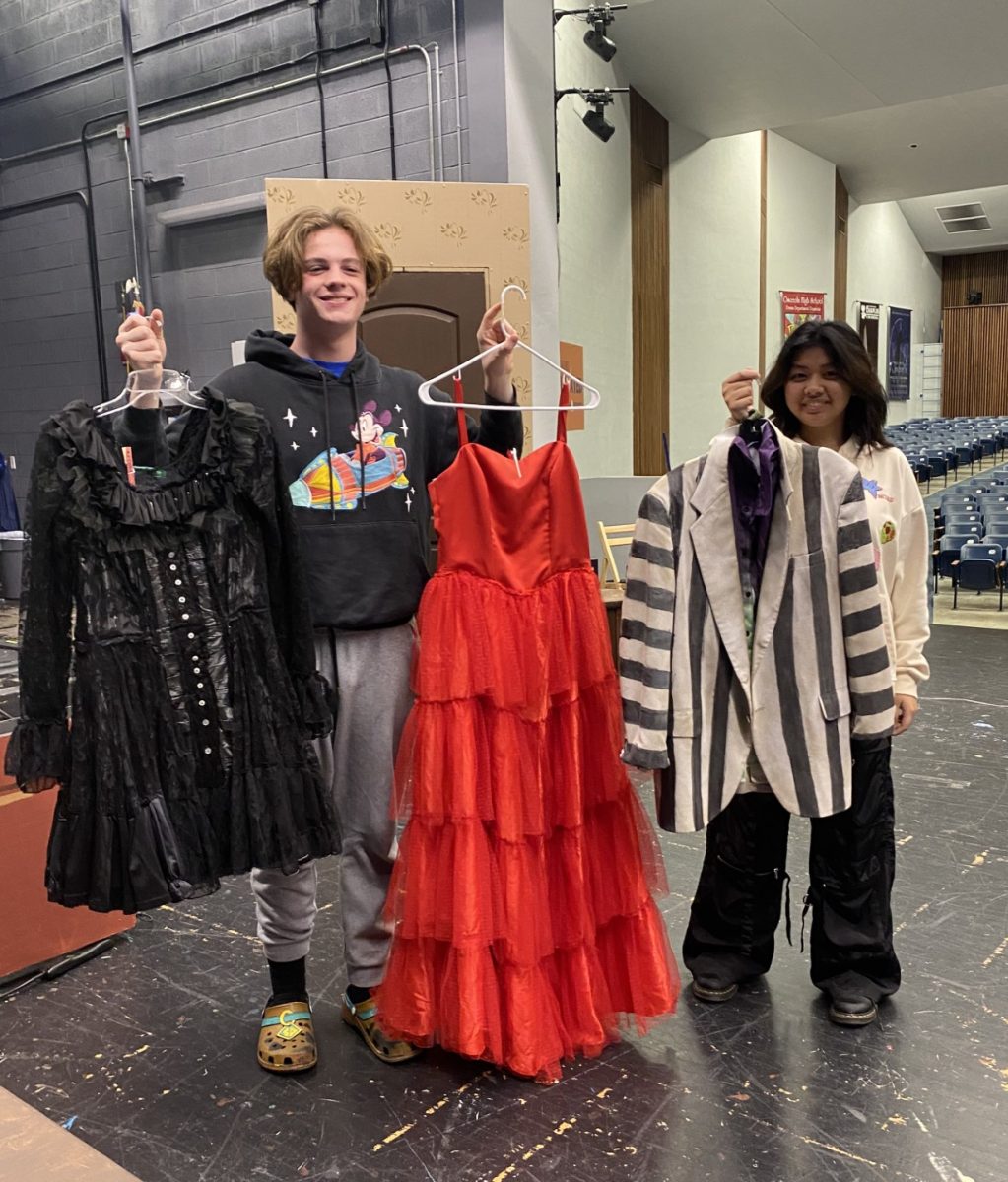 Costumes tailored by students that are waiting for cast members to wear on show day.