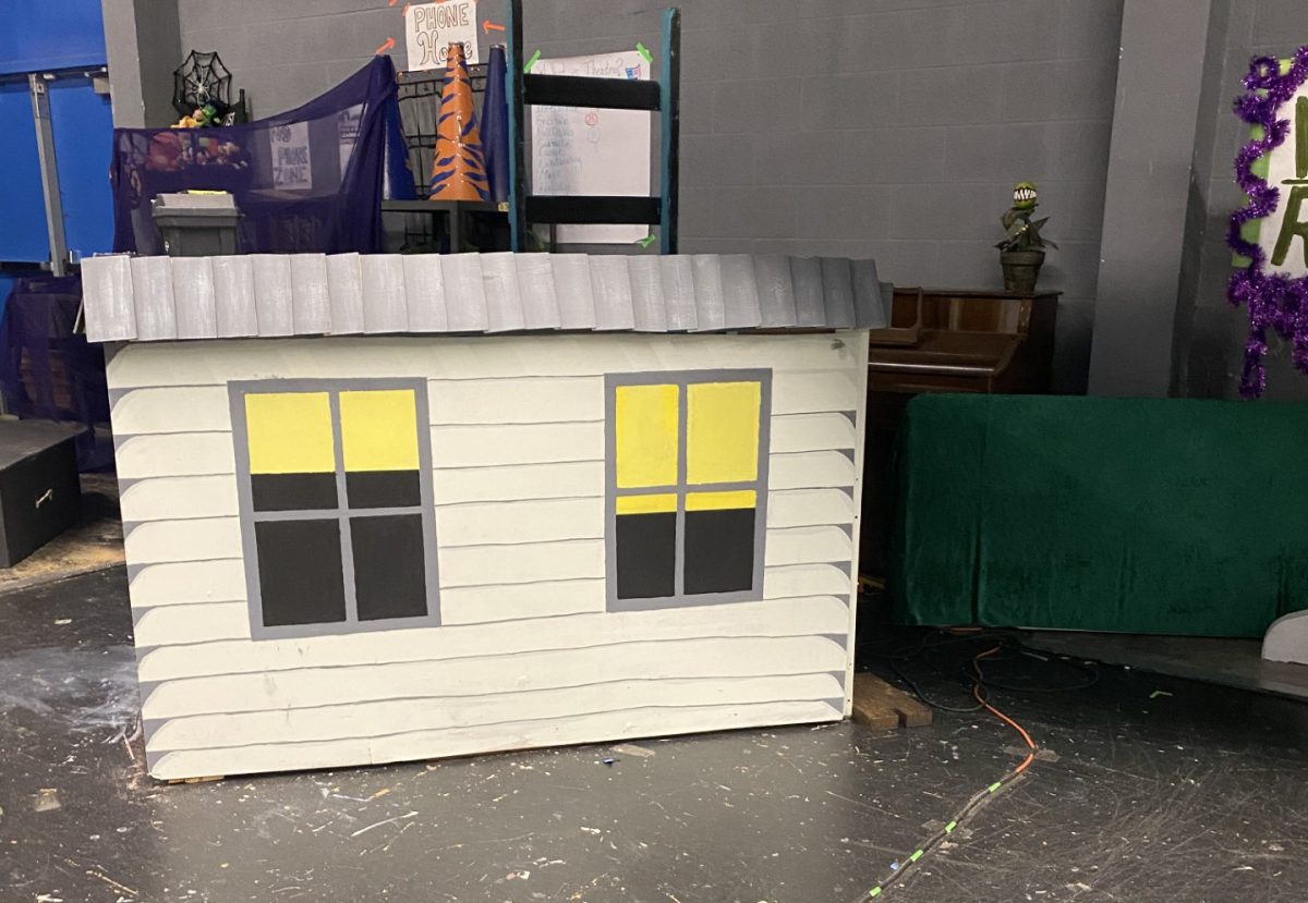 A small student-made house that will be seen in the background of the play.